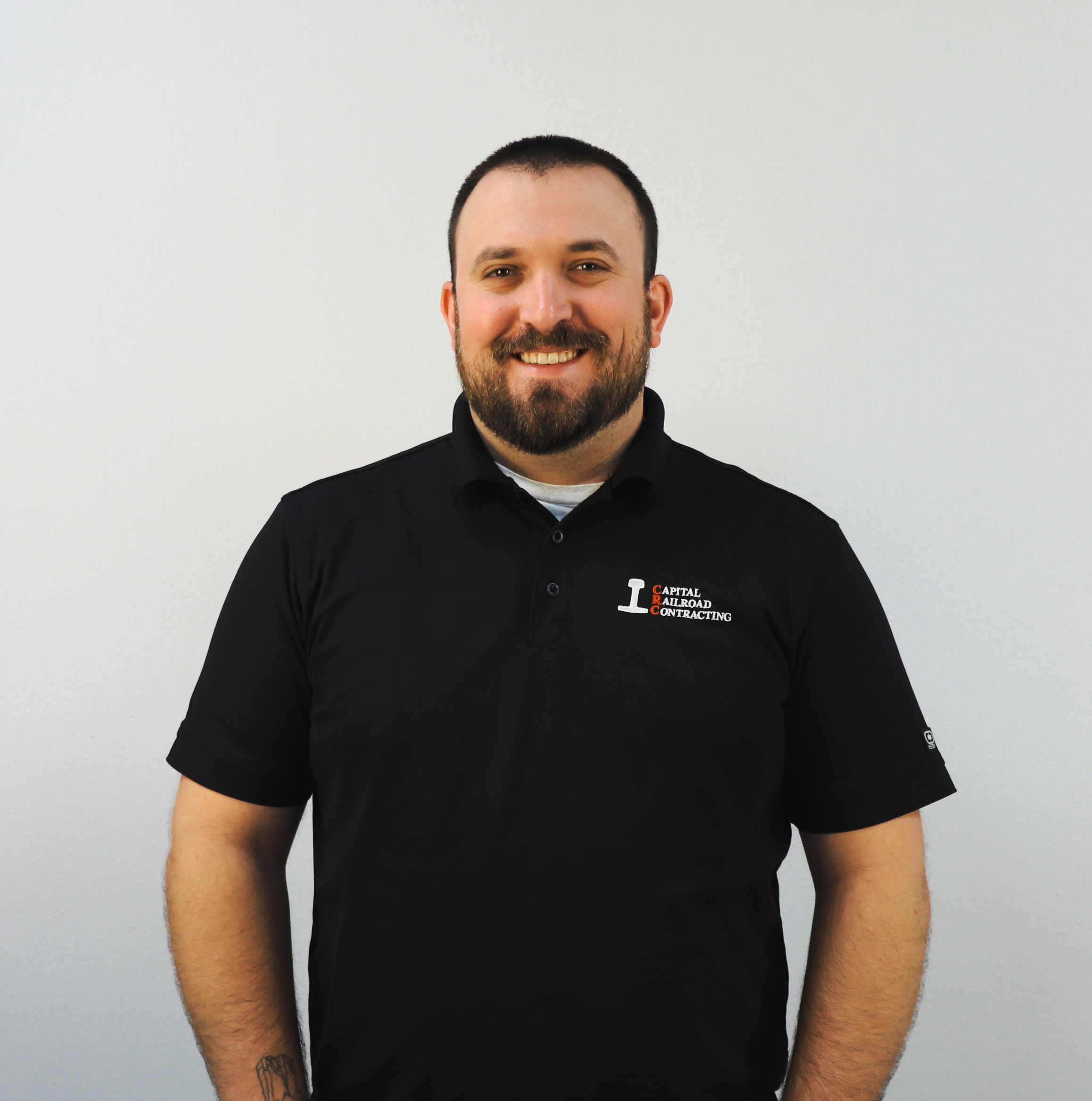 Person in black polo shirt