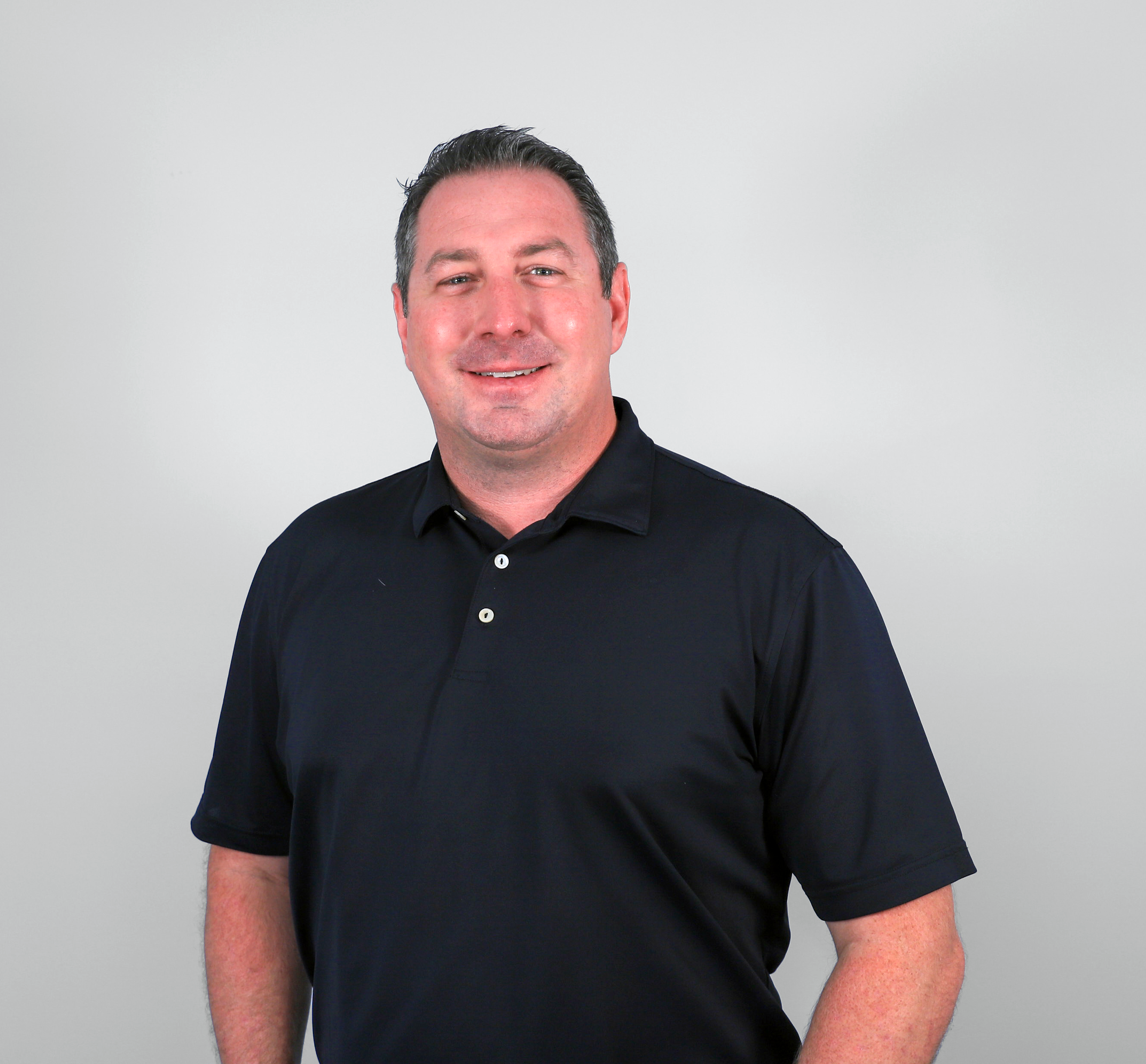 Man in black polo shirt