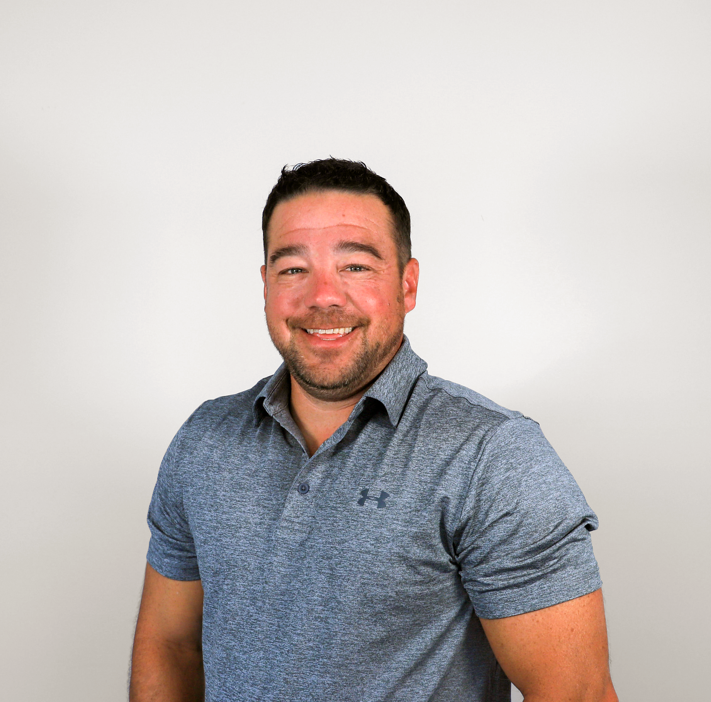 Man in gray polo shirt