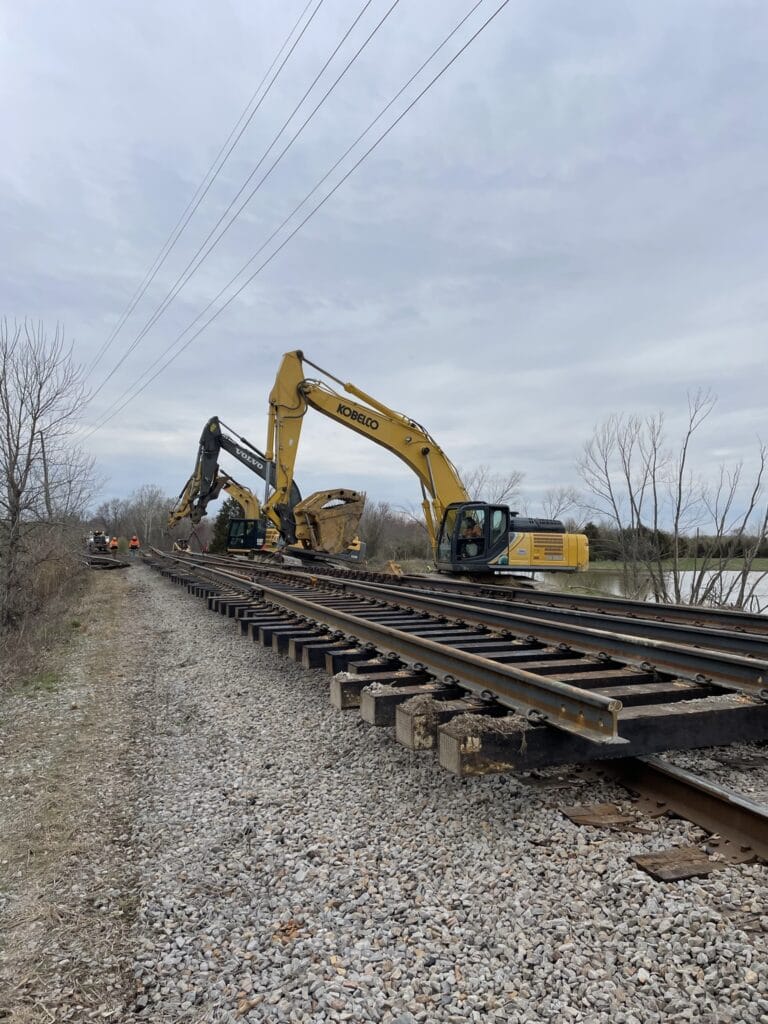 Heavy machinery working on railroad tracks