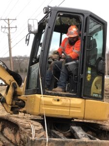 Construction worker operating heavy machinery.